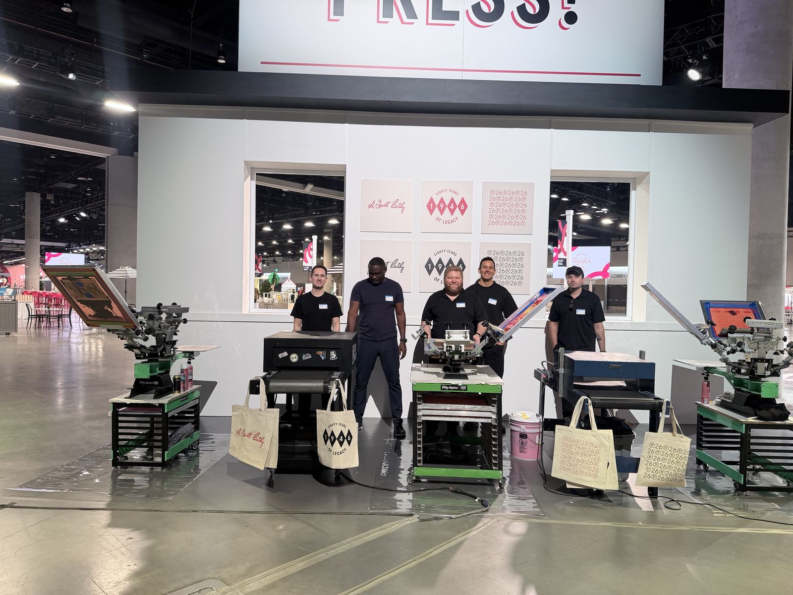 Merch Troop live screen-printing station running at a Charlotte event